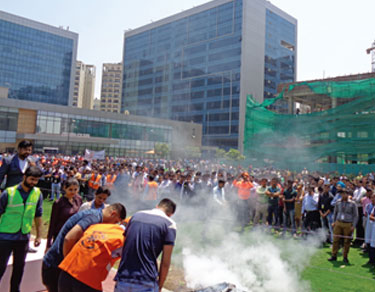 Fire extinguisher operation by employees in Assembly area - Candor TechSpace