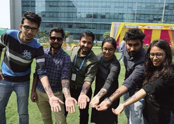 Employees showing off their hand art